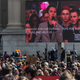 Crowds at US Navy Memorial Plaza watchs as David Hogg, a survivor of the Parkland shooting speaks